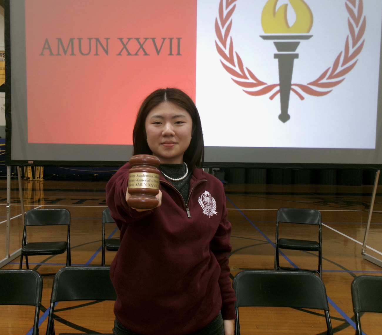 Claire Jiang holding the secretary-general's gavel at AMUN XXVII