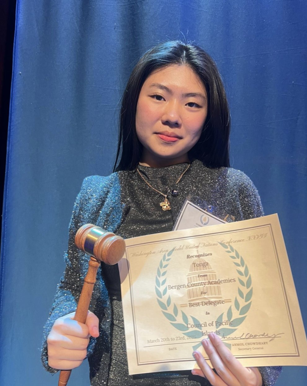 Claire Jiang with the Best Delegate gavel and certificate for Tonga at WAMUNC