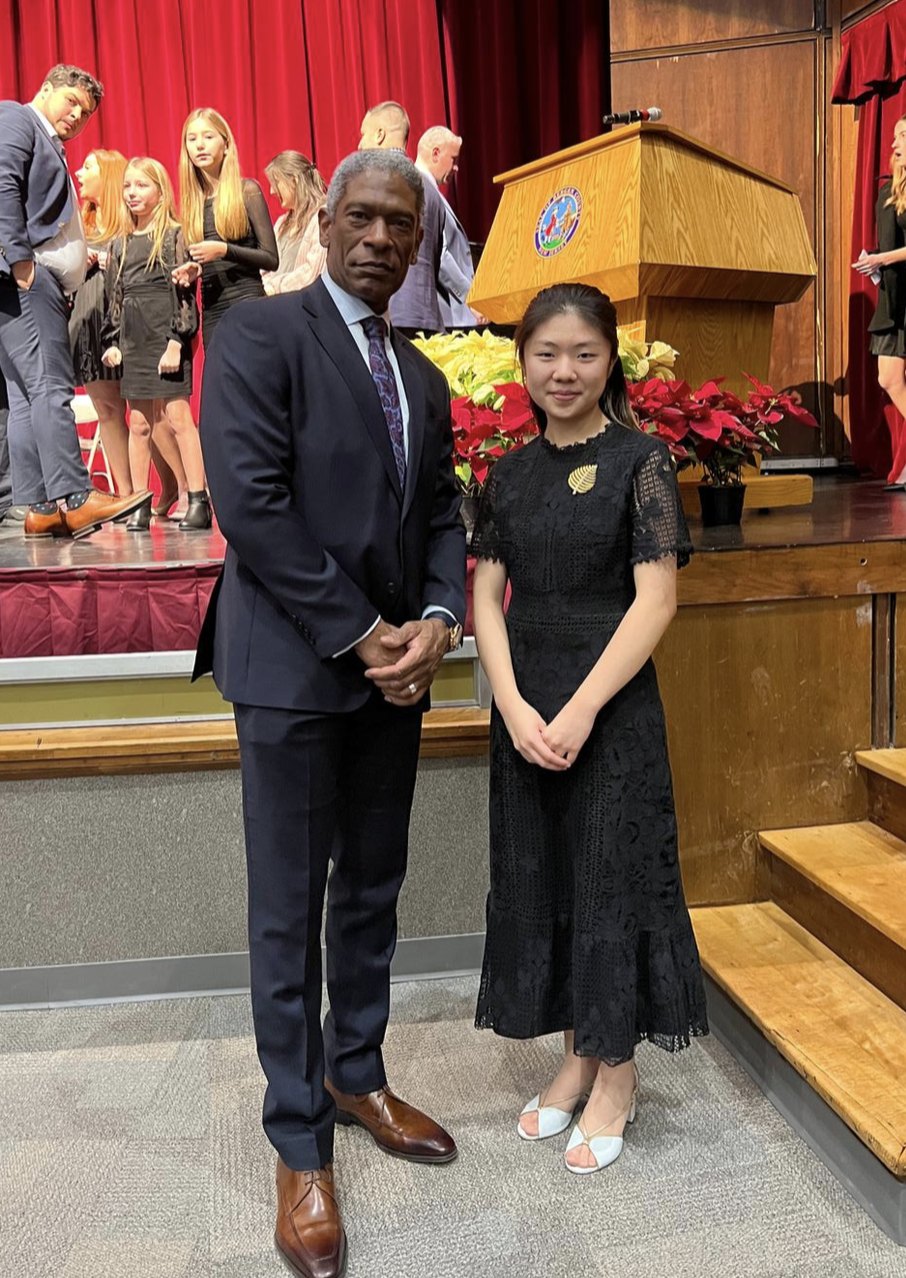 Claire Jiang with a Bergen County Technical Schools official after performing