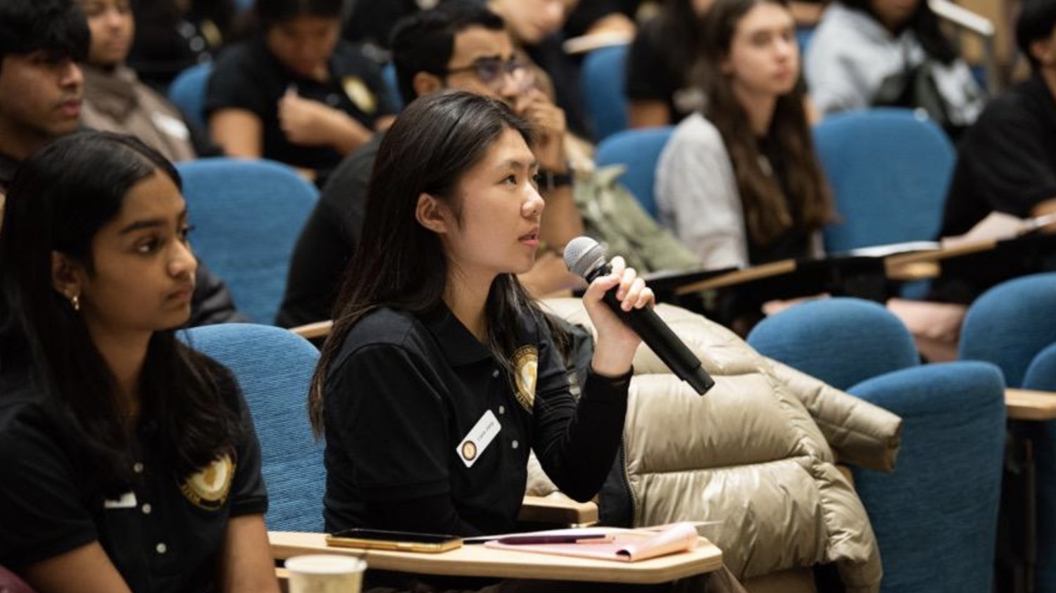 Claire Jiang asking a question at a Governor's STEM Scholars conference