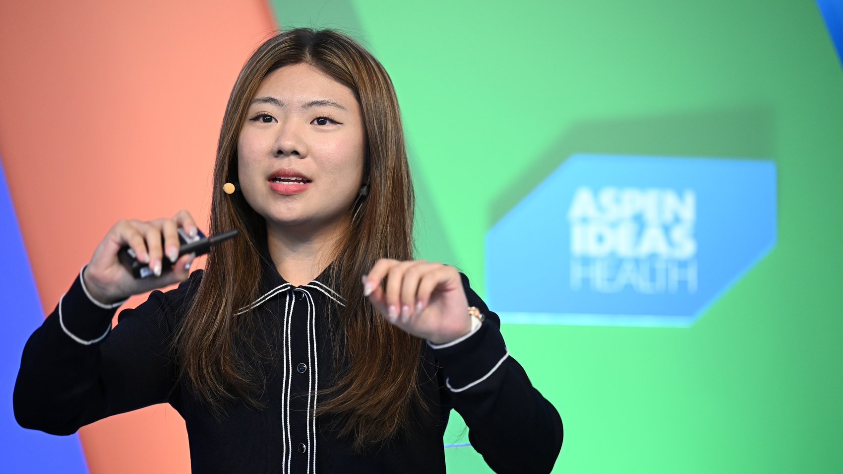 Claire Jiang speaking on stage at Aspen Ideas: Health