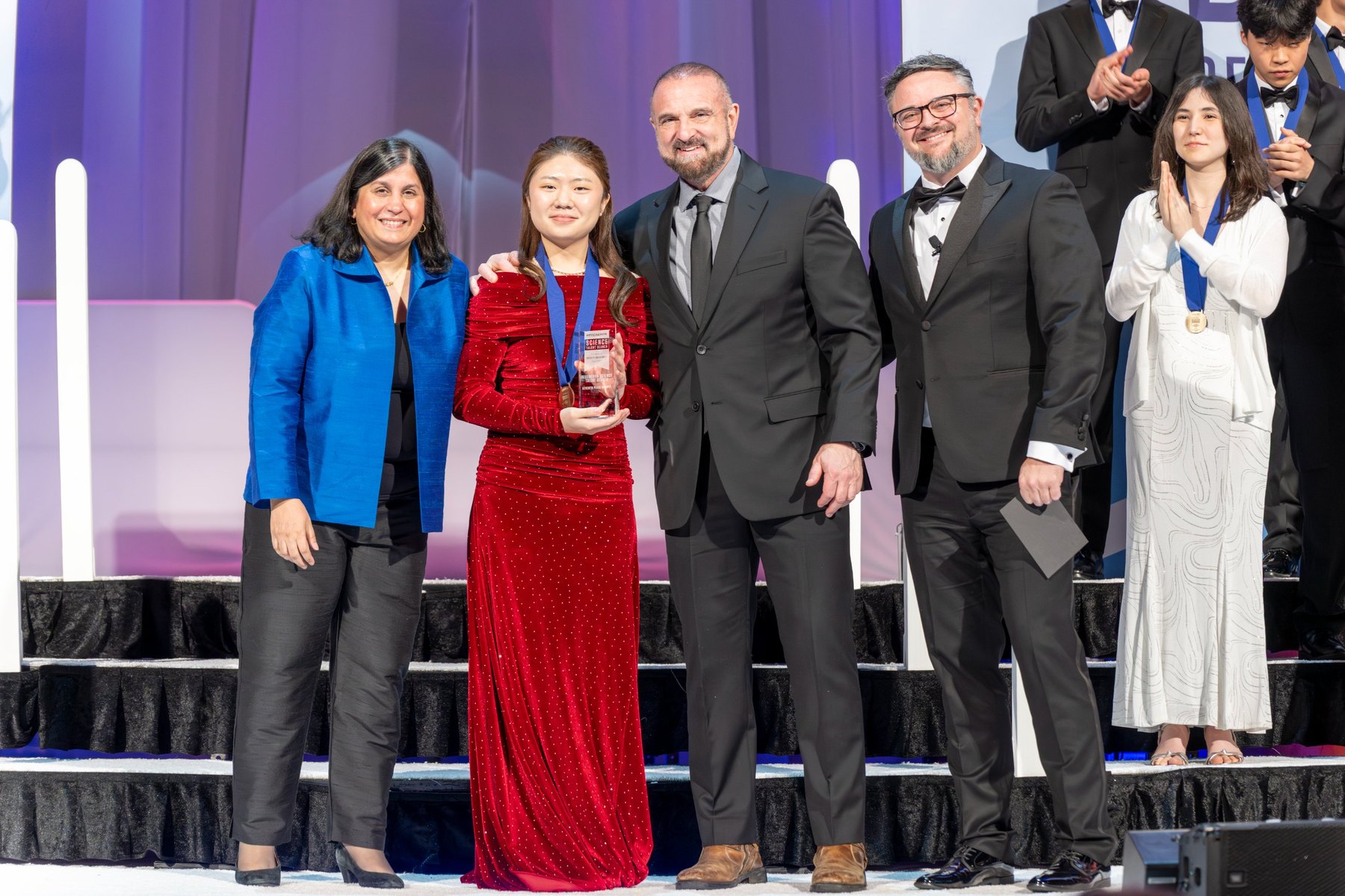 Claire accepting her 7th place award on stage at the Regeneron Science Talent Search awards gala